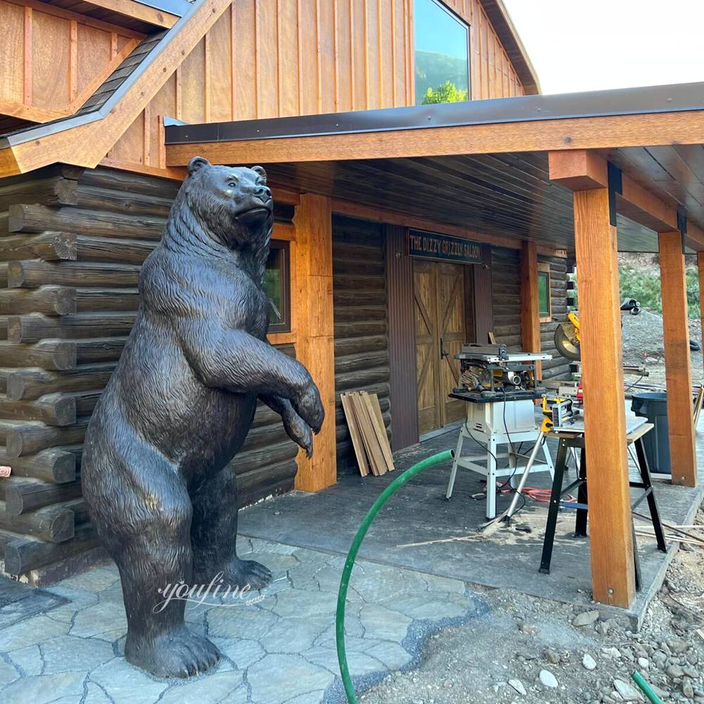 High Quality Bear Sculpture Standing by a Log Cabin in the USA