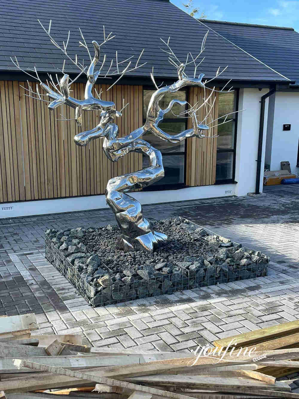 Stainless steel tree sculpture feedback- in a private garden