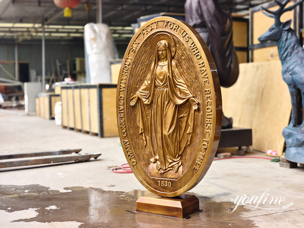 virgin mary relief sculpture