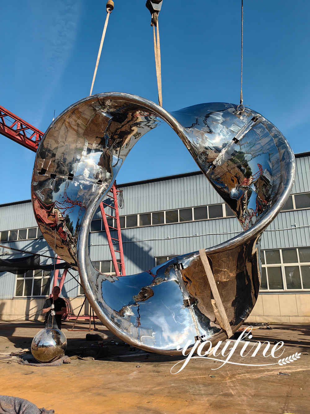 stainless steel Möbius strip sculpture trial installation