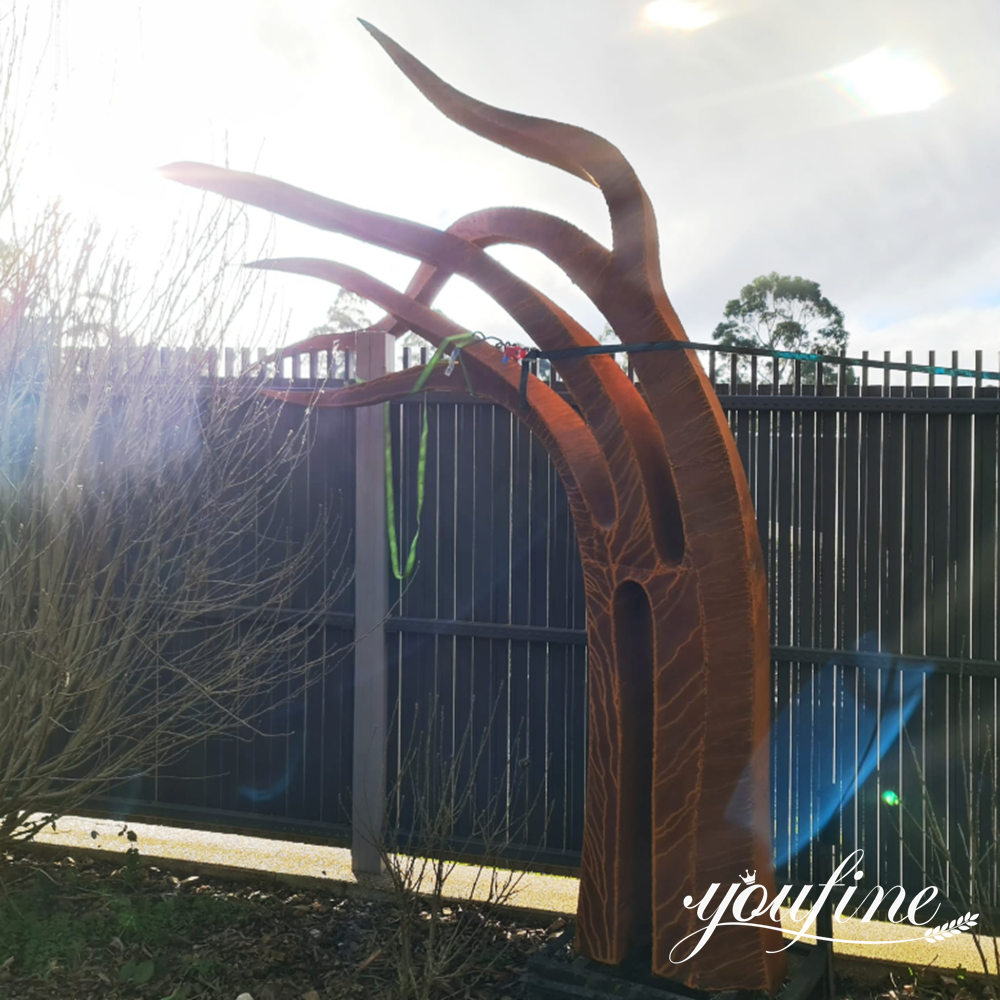 Corten steel abstract tree sculpture enhancing a modern residential landscape in Australia.