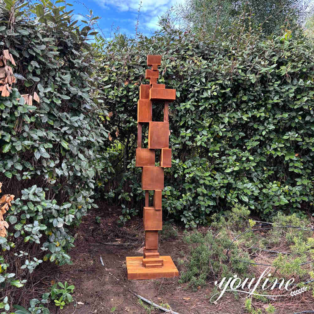 Custom corten steel sculpture installed in a private garden in France.