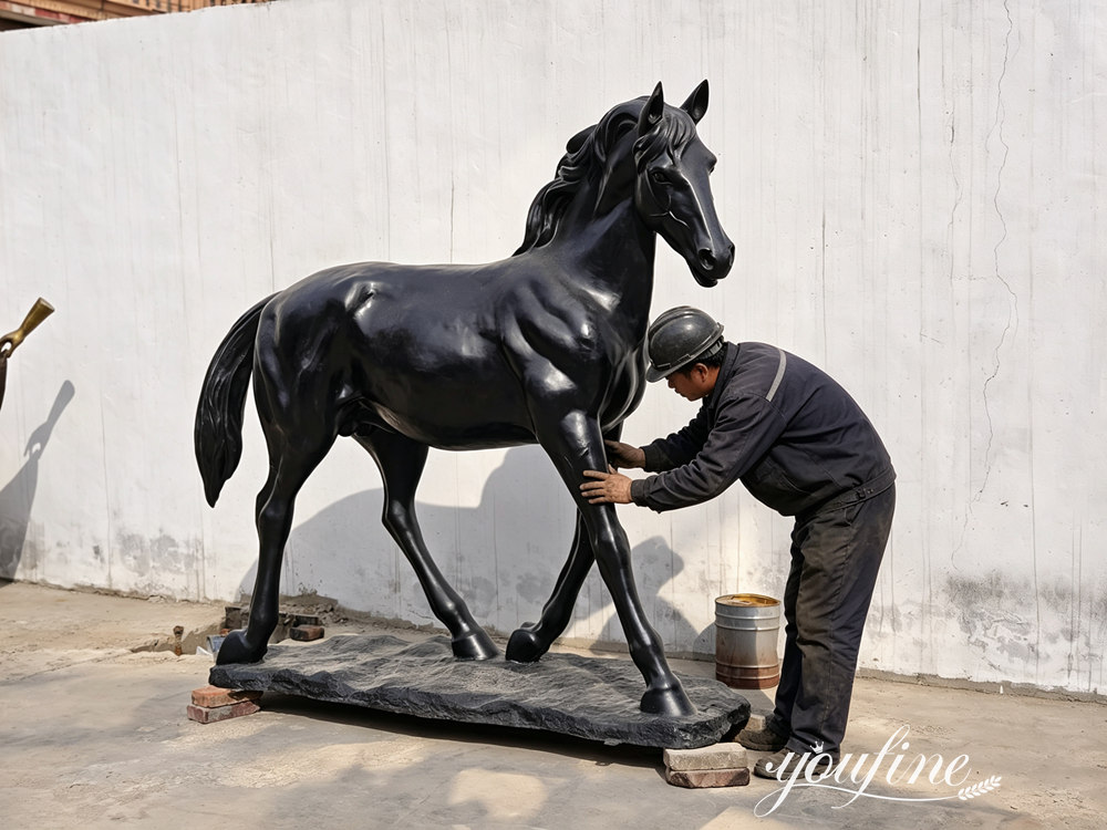 QC checking the sculpture's quality