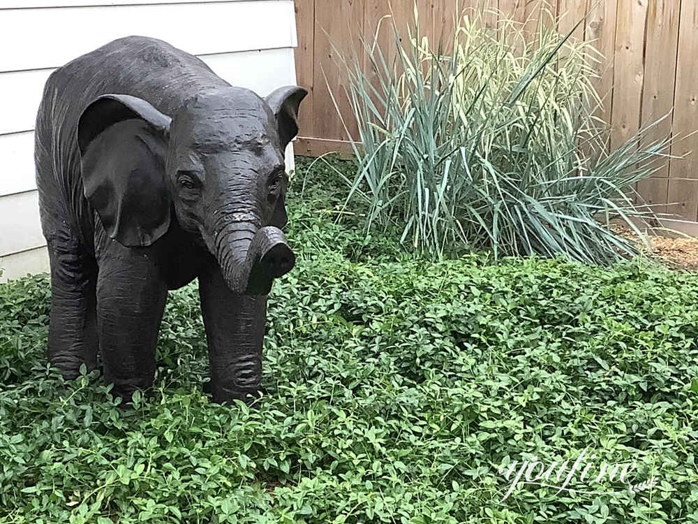 Canadian client feedback showing the bronze baby elephant outside their home