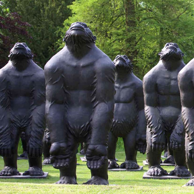 Standing gorilla sculpture installation