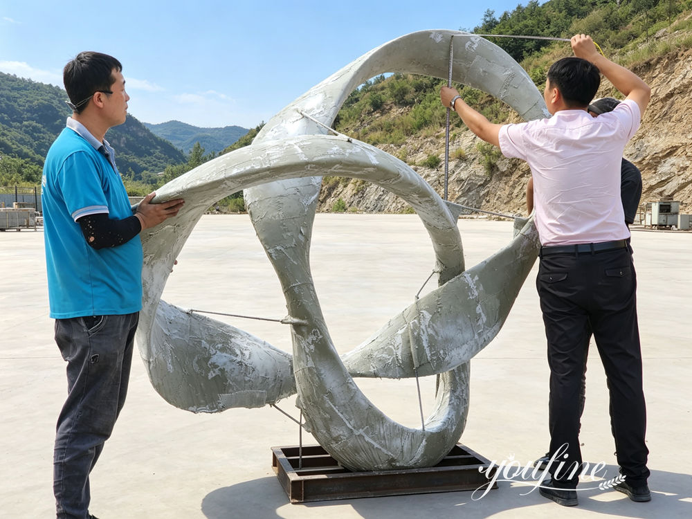 Confirmação dos detalhes da escultura do nó infinito