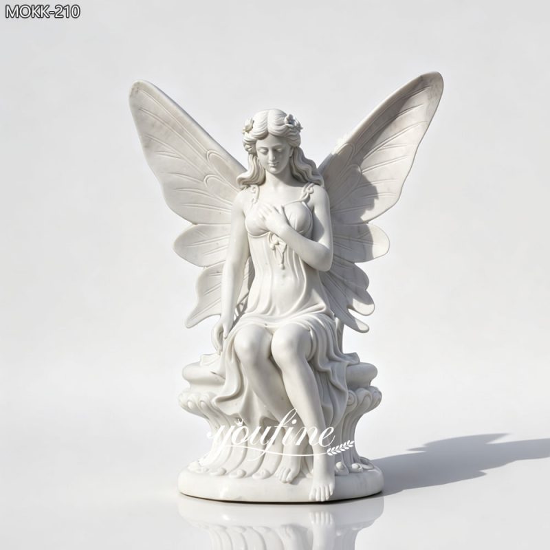 white marble sitting fairy statue